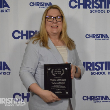 Photo of Valerie Jermusyk with Teacher of the Year Award